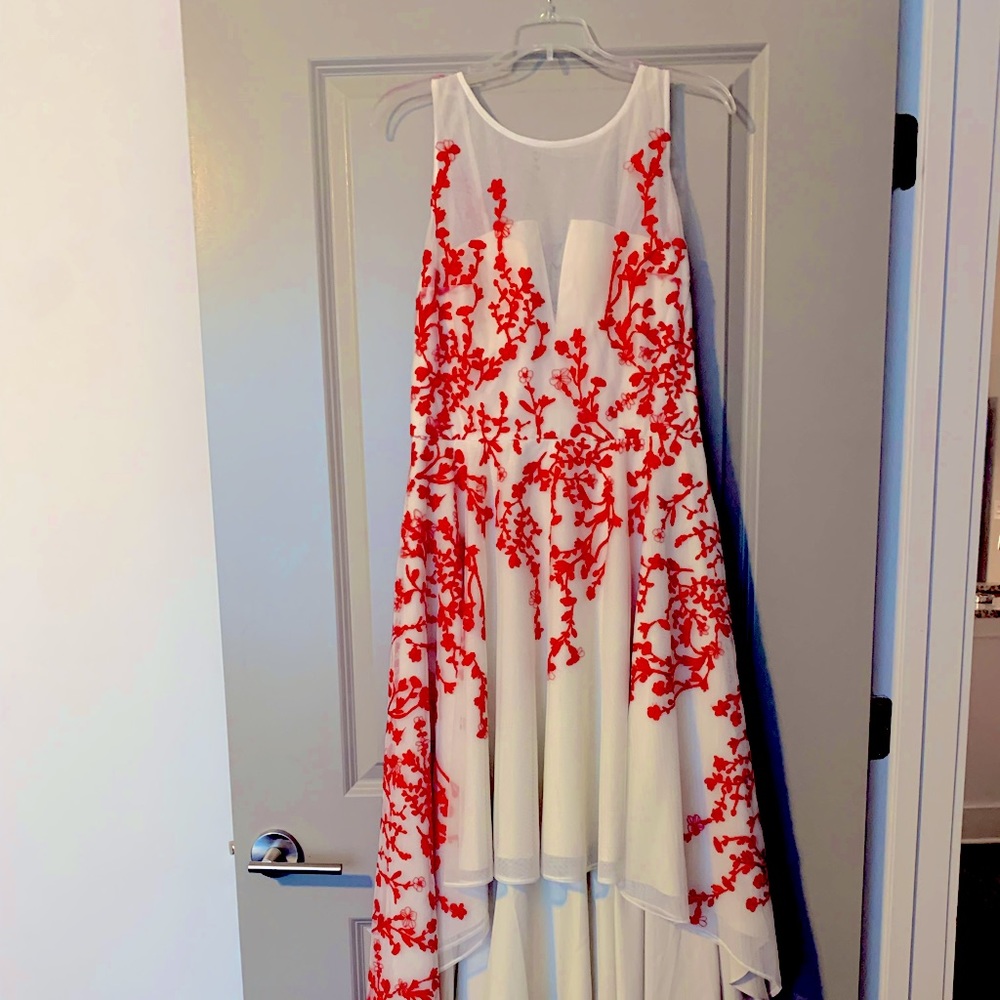 Embroidered floral high-low dress.